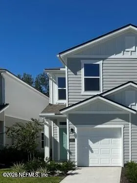a front view of a house with a garage