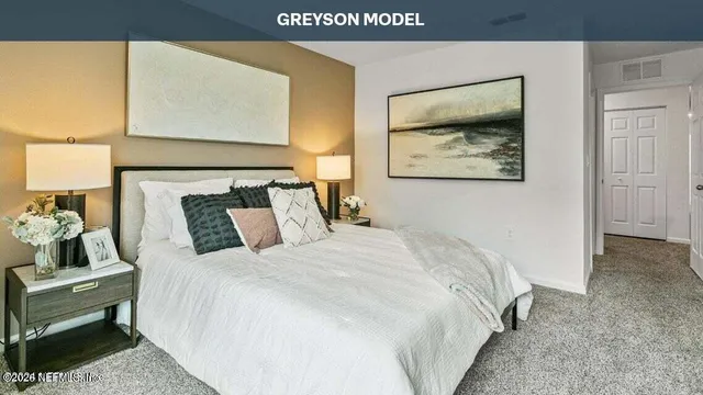 a view of a hallway with wooden floor and windows