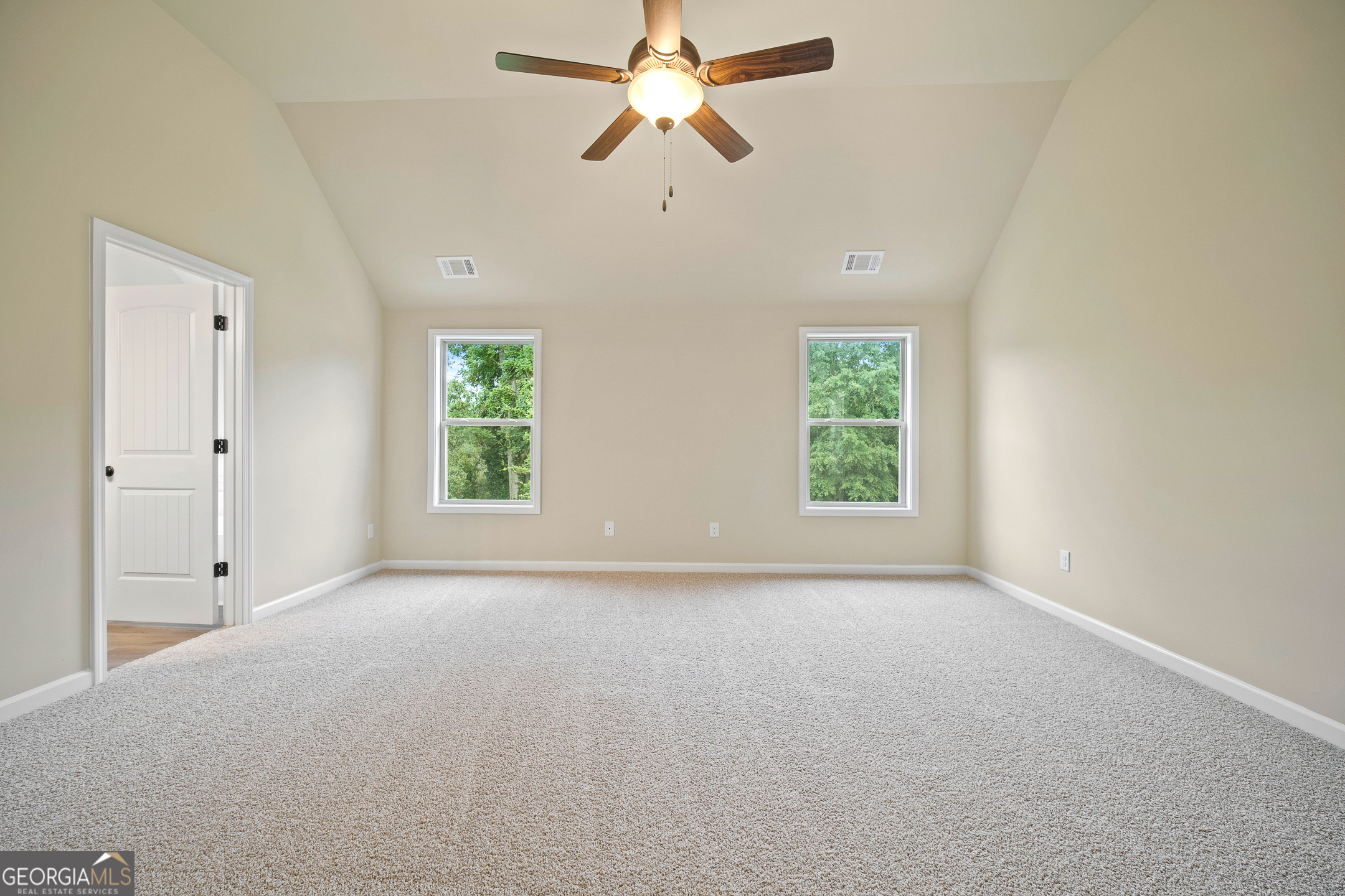 2275 Lovejoy Road Hampton, GA 30228 - Photo 15 of 20 an empty room with windows and fan
