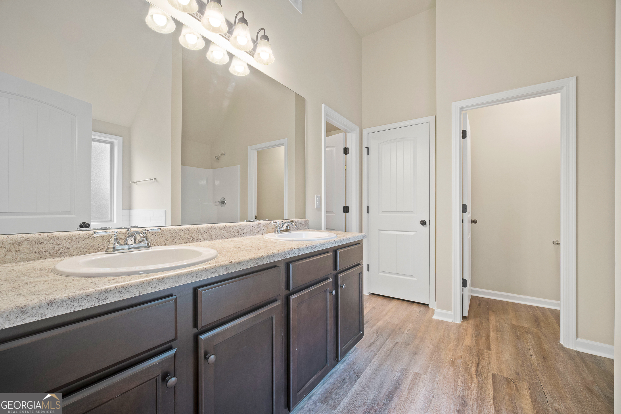 2275 Lovejoy Road Hampton, GA 30228 - Photo 17 of 20 a bathroom with a granite countertop sink a toilet and a mirror