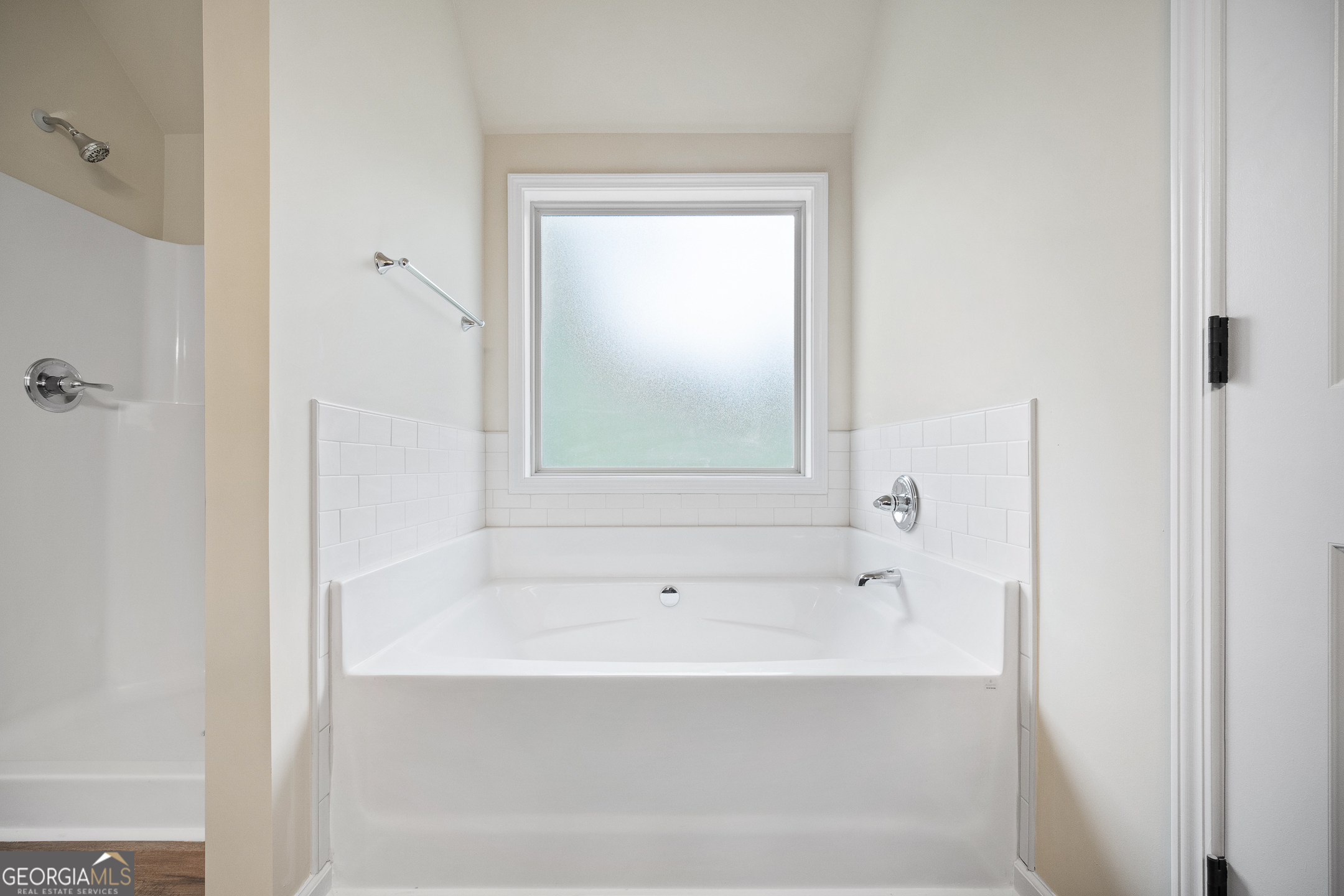 2275 Lovejoy Road Hampton, GA 30228 - Photo 18 of 20 a bathroom with bathtub and window