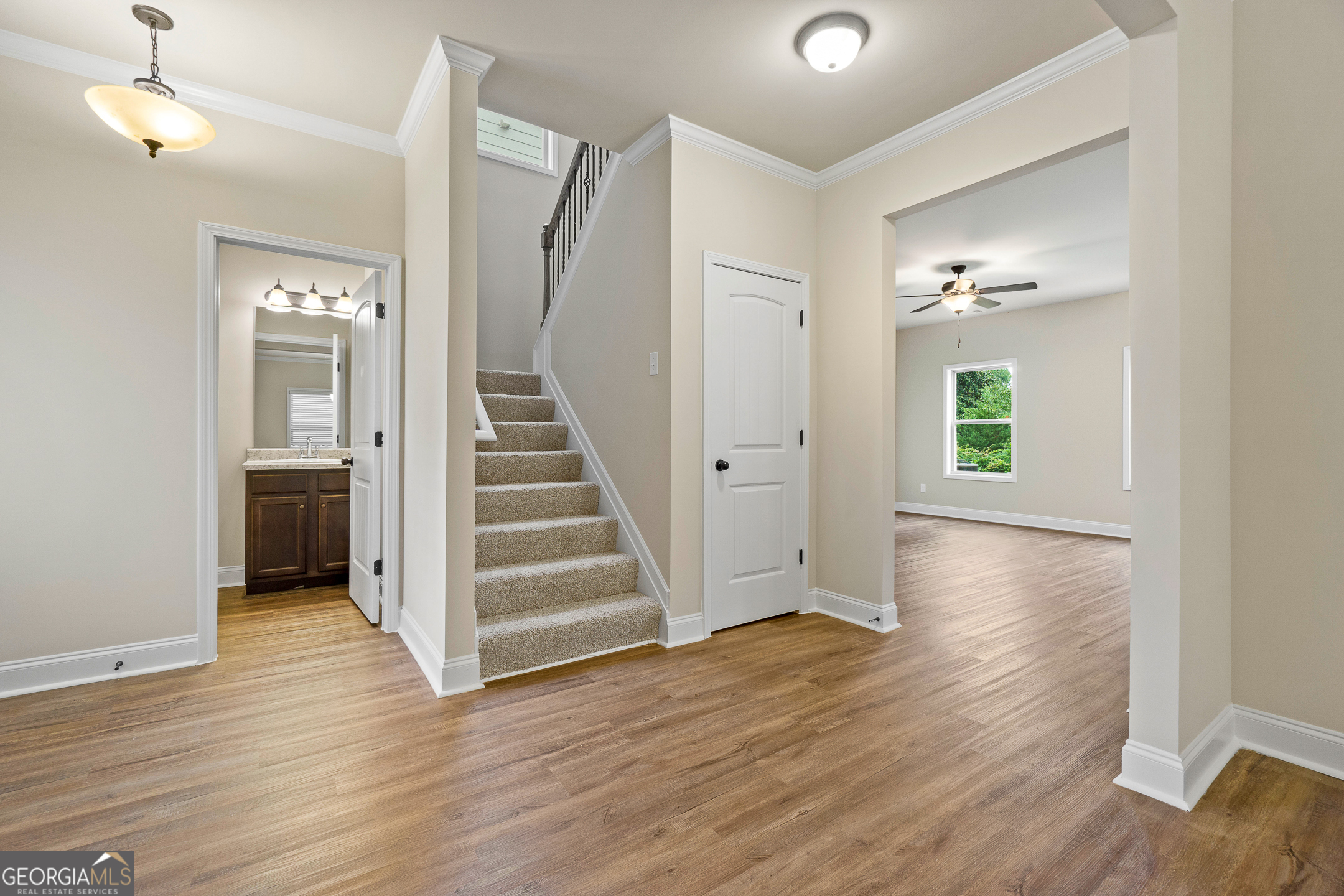 2275 Lovejoy Road Hampton, GA 30228 - Photo 3 of 20 wooden floor in an empty room with a window and wooden floor