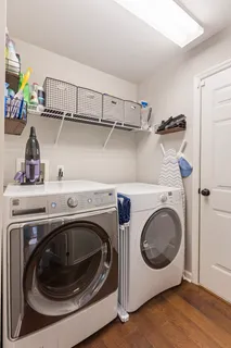 a spacious bedroom with a bed and ceiling fan