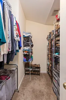 a bathroom with a granite countertop sink a mirror and a bathtub