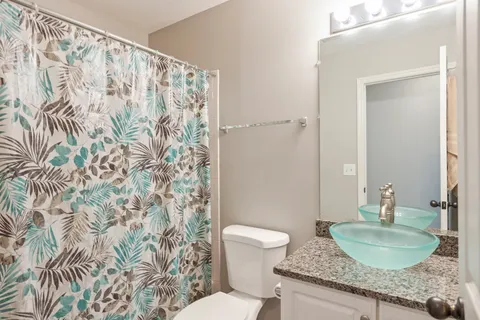 a living room with furniture a air conditioner and a window