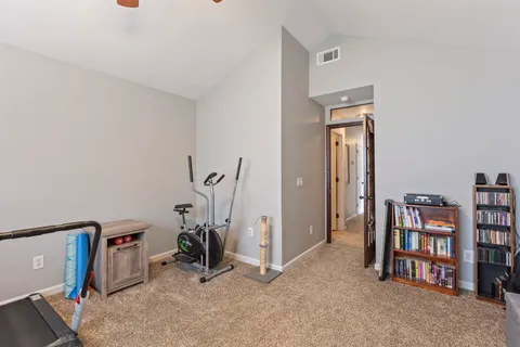 a living room with a flat screen tv and a couch