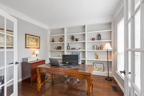 a workspace with furniture window and wooden floor