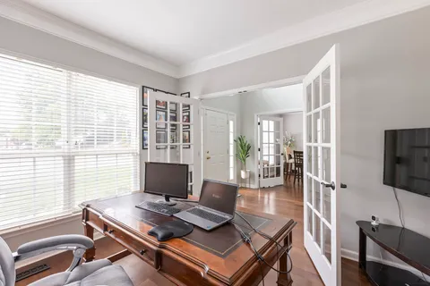 a view of a livingroom with furniture and a flat screen tv