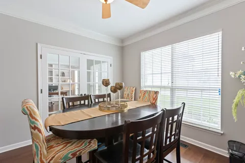 a view of a dining room with furniture and window