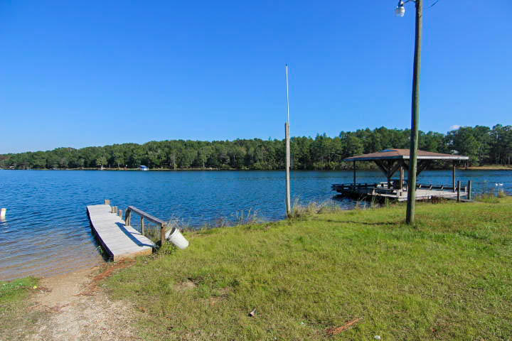 0 Spring Lake Road DeFuniak Springs, FL 32433 - Photo 11 of 16 a view of a lake with a sitting space