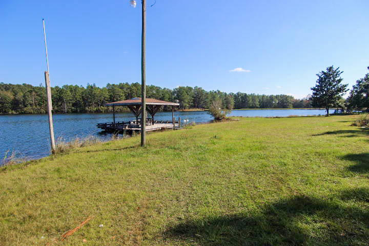 0 Spring Lake Road DeFuniak Springs, FL 32433 - Photo 12 of 16 a view of a swimming pool with lawn chairs