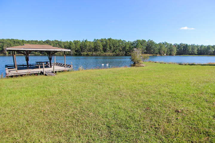 0 Spring Lake Road DeFuniak Springs, FL 32433 - Photo 13 of 16 a view of a swimming pool with lounge chair