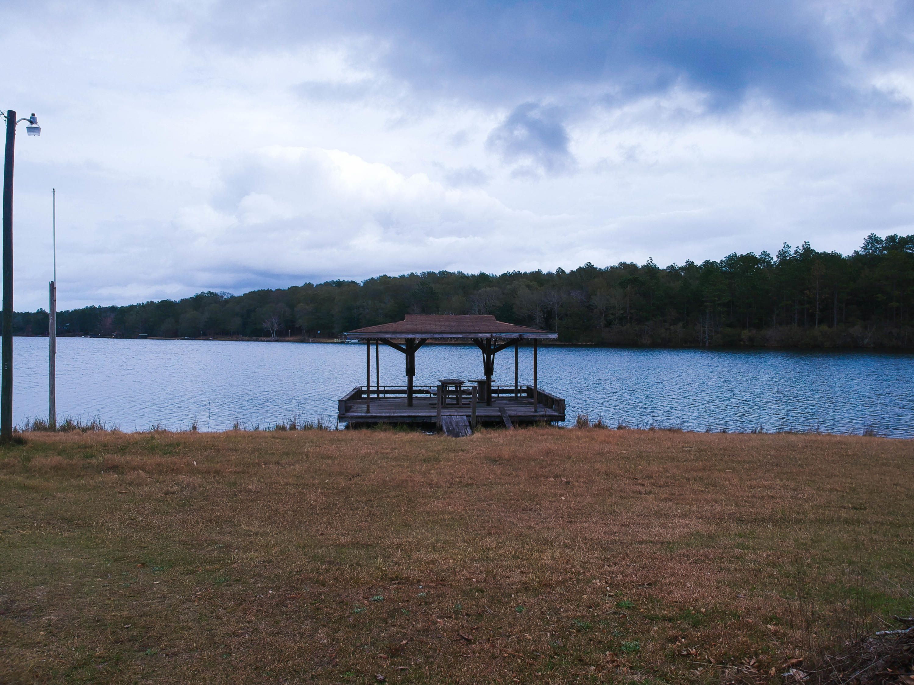 0 Spring Lake Road DeFuniak Springs, FL 32433 - Photo 14 of 16 a view of a lake with houses in back