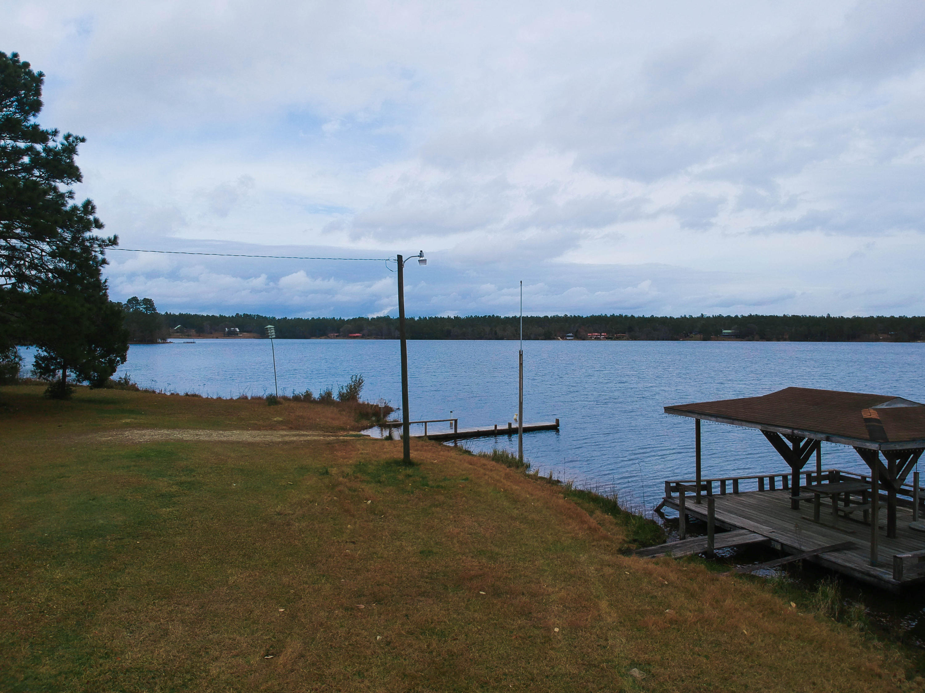 0 Spring Lake Road DeFuniak Springs, FL 32433 - Photo 16 of 16 a view of a lake with houses in the back