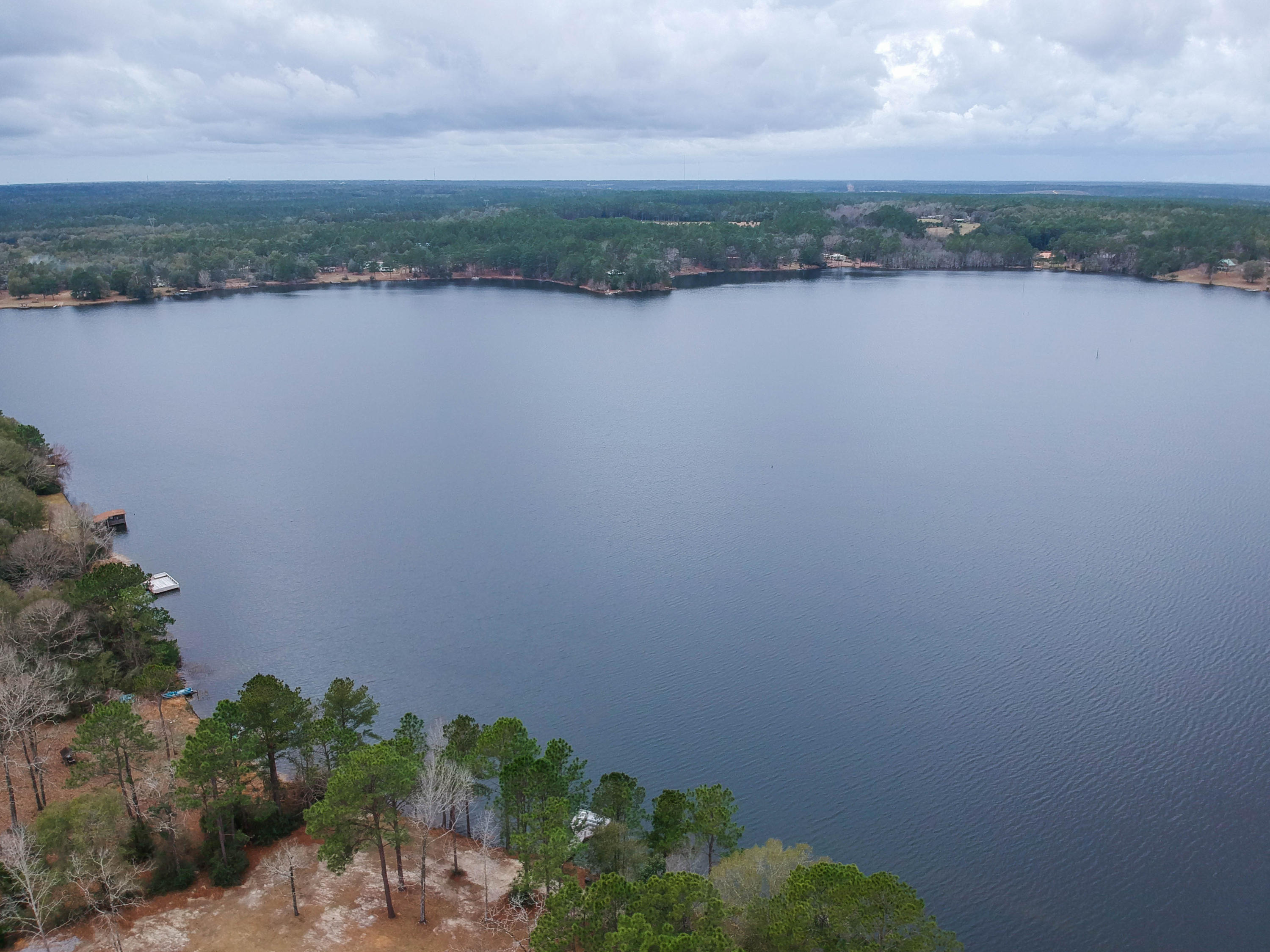 0 Spring Lake Road DeFuniak Springs, FL 32433 - Photo 2 of 16 an aerial view of a residential houses with outdoor space and lake view