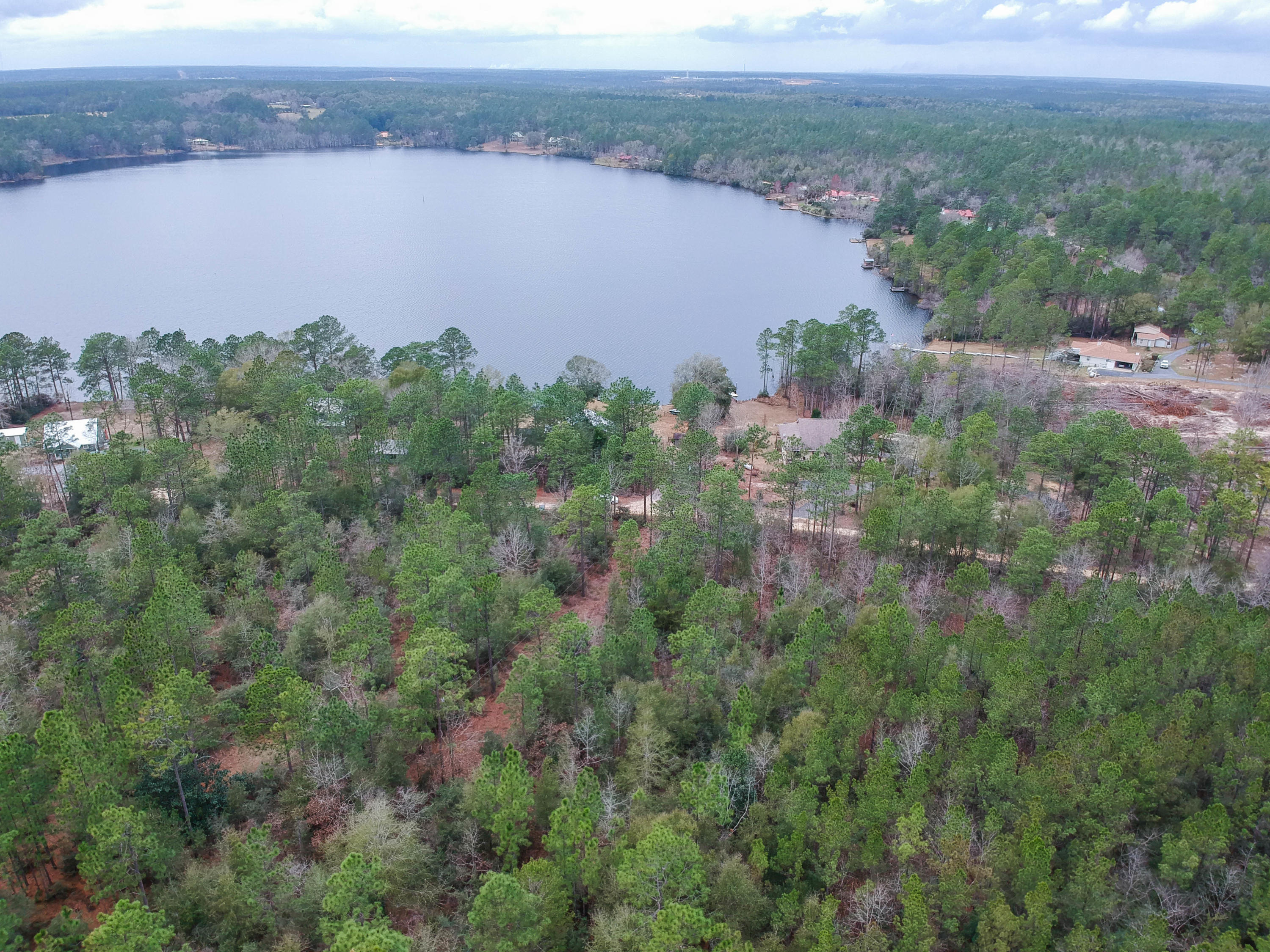 0 Spring Lake Road DeFuniak Springs, FL 32433 - Photo 5 of 16 an aerial view of a houses with a lake view