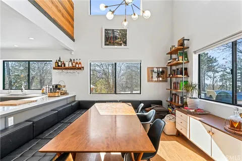 a large white kitchen with a large window