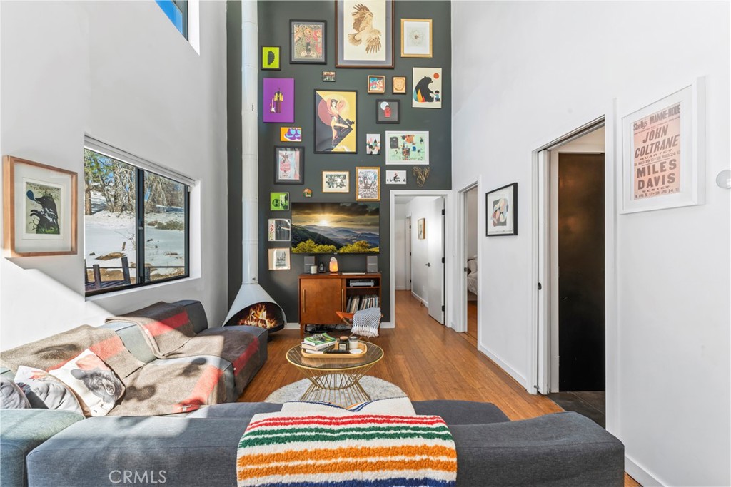 32945 Juniper Lane Green Valley Lake, CA 92341 - Photo 15 of 53 a living room with furniture and floor to ceiling windows