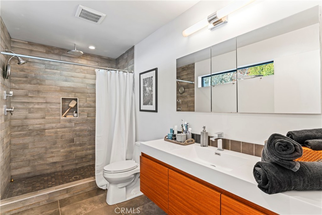 32945 Juniper Lane Green Valley Lake, CA 92341 - Photo 18 of 53 a bathroom with a sink a toilet and shower