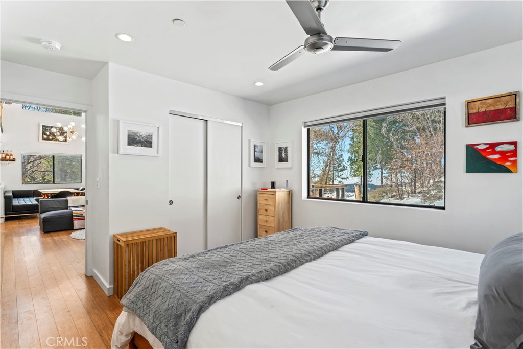 32945 Juniper Lane Green Valley Lake, CA 92341 - Photo 19 of 53 a bedroom with a bed and a large window