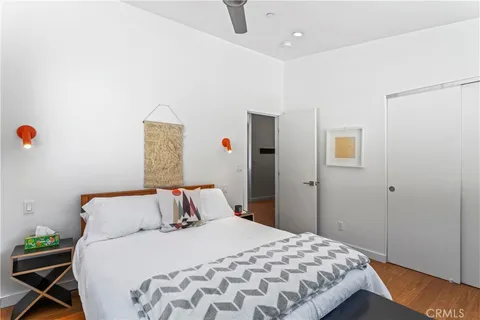 a bedroom with a bed and a dresser