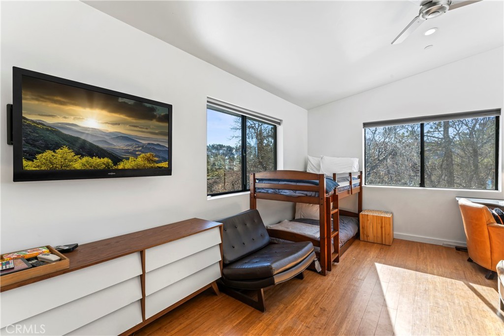 32945 Juniper Lane Green Valley Lake, CA 92341 - Photo 30 of 53 a living room with furniture and a flat screen tv