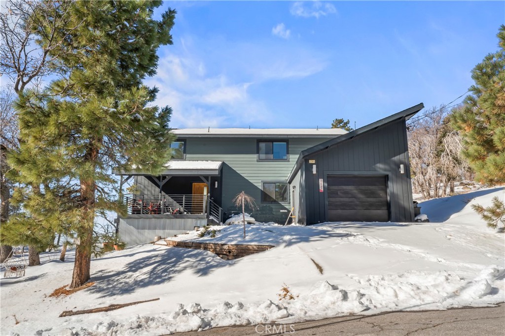 32945 Juniper Lane Green Valley Lake, CA 92341 - Photo 3 of 53 a view of a house with snow in front of it