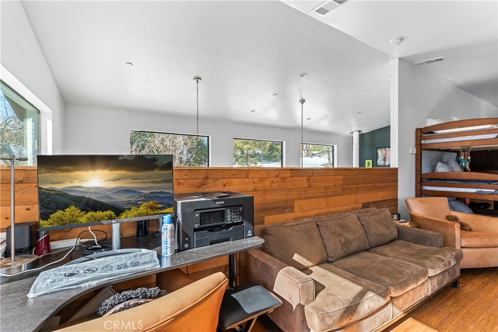 32945 Juniper Lane Green Valley Lake, CA 92341 - Photo 32 of 53 a living room with furniture and a flat screen tv