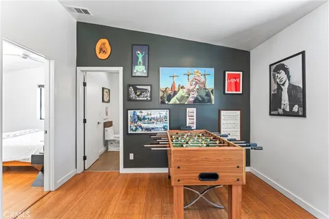 a view of kitchen with furniture and refrigerator