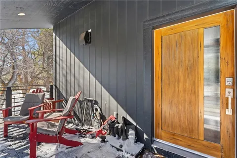 a view of an entryway with wooden floor