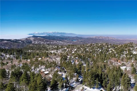 a view of mountain view with lots of trees