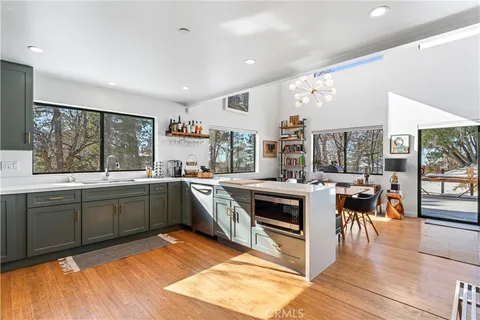 a kitchen with stainless steel appliances granite countertop a stove and a sink