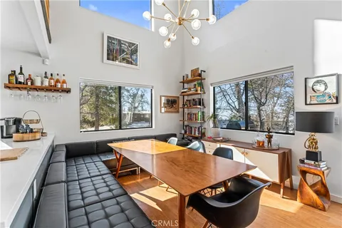 a dining room with large window