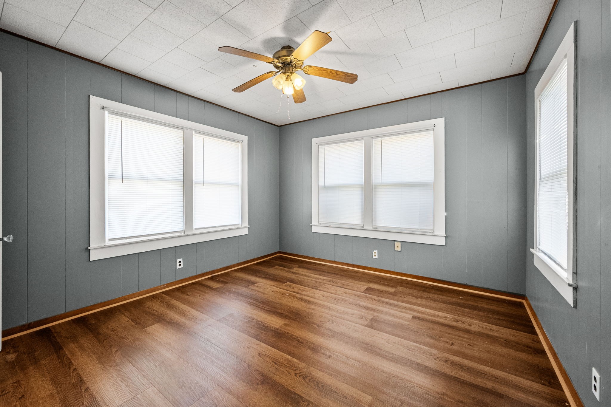 209 3rd Avenue Columbus, TX 78934 - Photo 22 of 34 a view of an empty room with window and wooden floor