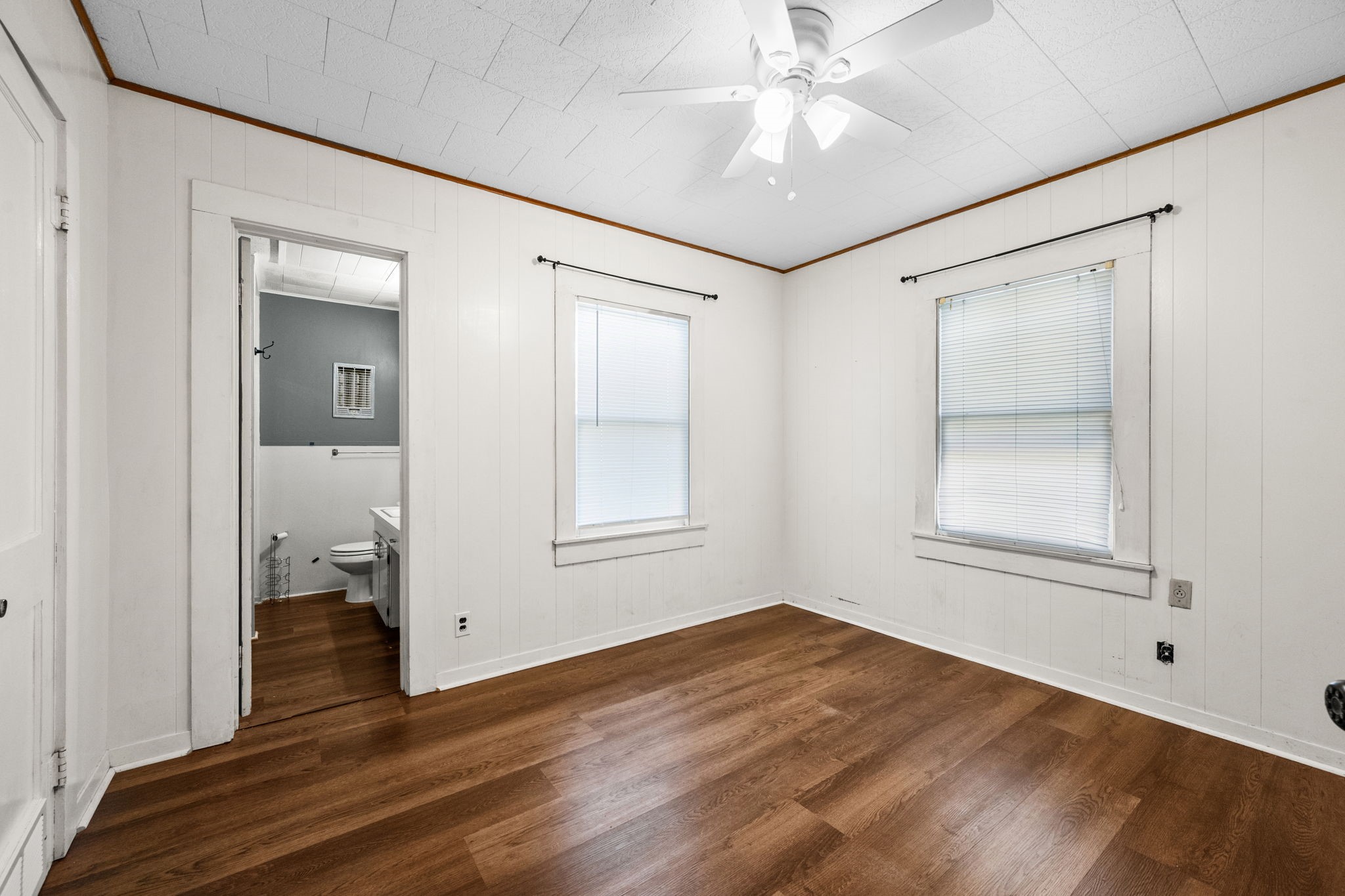 209 3rd Avenue Columbus, TX 78934 - Photo 24 of 34 a view of empty room with wooden floor and fan
