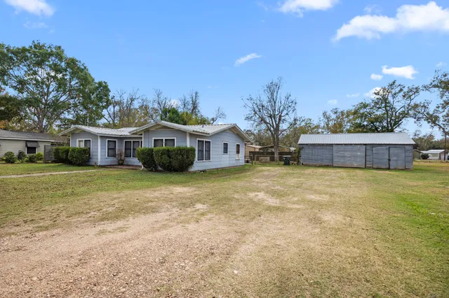 a front view of house with yard and seating area