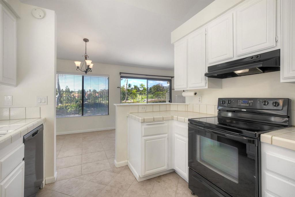 1394 Longfellow Road Vista, CA 92081 - Photo 21 of 50 a kitchen with a stove and a sink