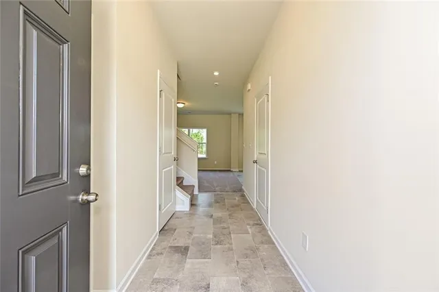 a view of a hallway with a white walls