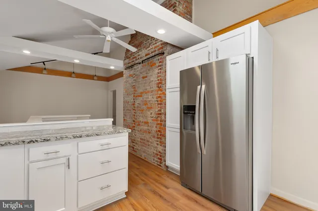 a view of cabinets with wooden floor