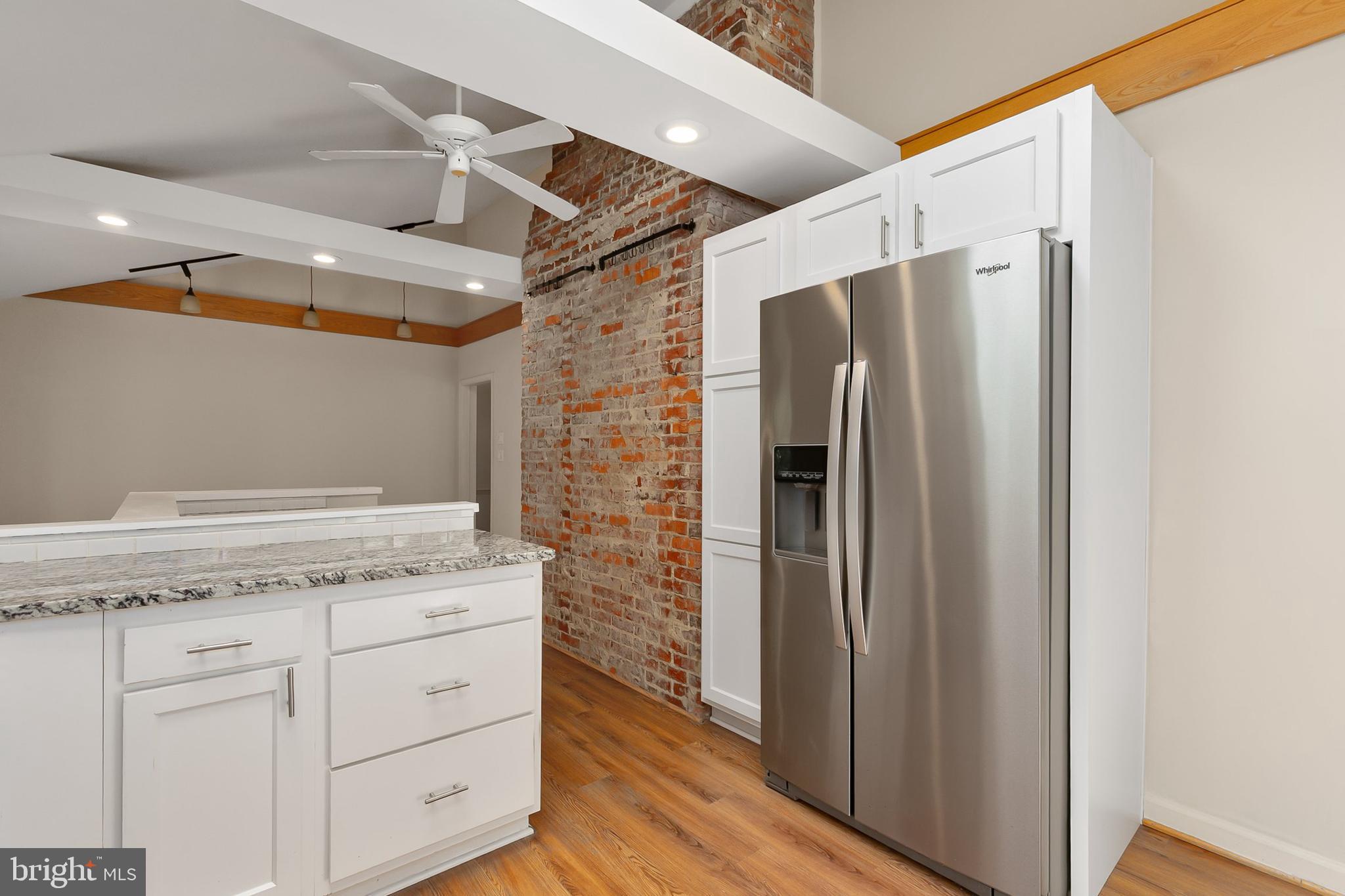 10601 Kinloch Road Silver Spring, MD 20903 - Photo 16 of 47 a view of cabinets with wooden floor
