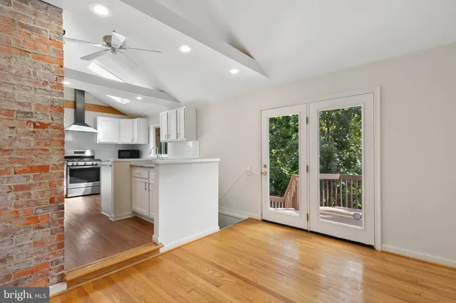 a view of kitchen with cabinets and wooden floor
