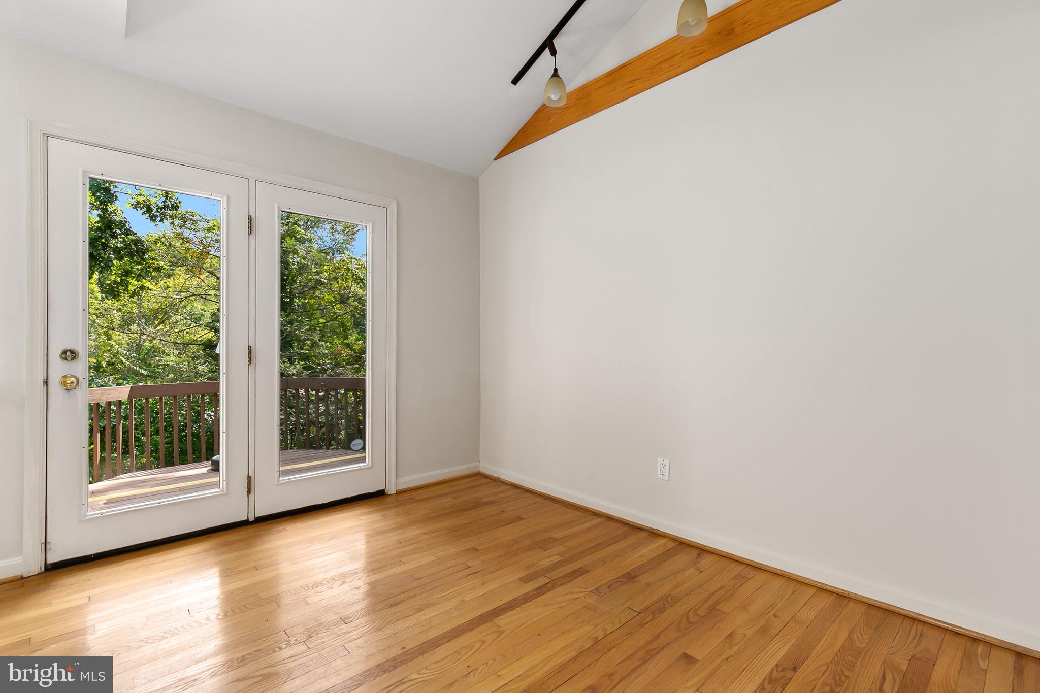 10601 Kinloch Road Silver Spring, MD 20903 - Photo 21 of 47 a view of a room with wooden floor and window