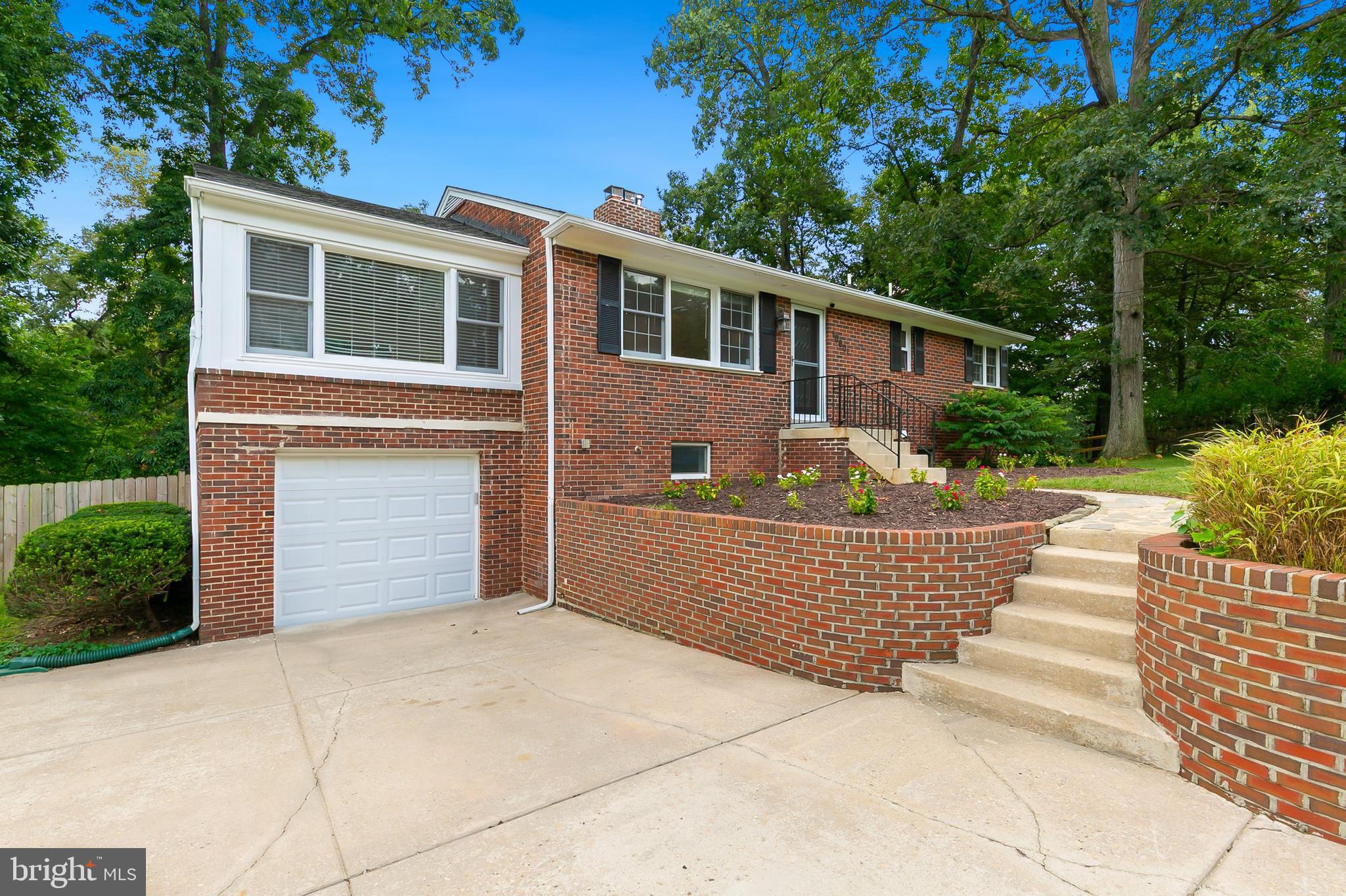 10601 Kinloch Road Silver Spring, MD 20903 - Photo 3 of 47 a front view of a house with a yard