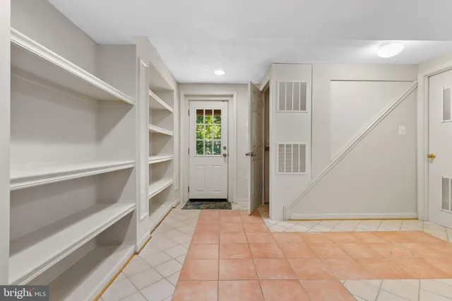 a view of an entryway with an empty room