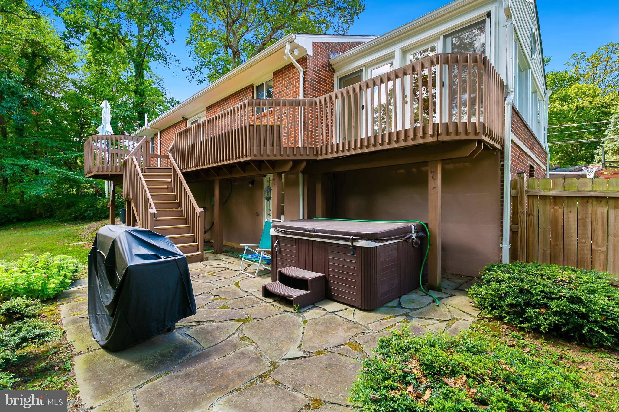 10601 Kinloch Road Silver Spring, MD 20903 - Photo 37 of 47 a view of a chairs and table in the back yard of the house