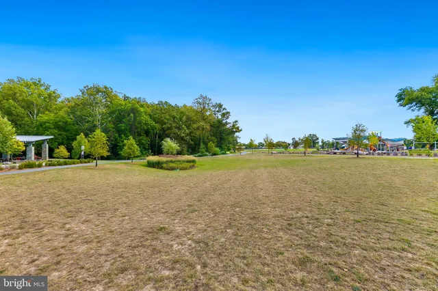 a view of a swimming pool with a lawn chairs