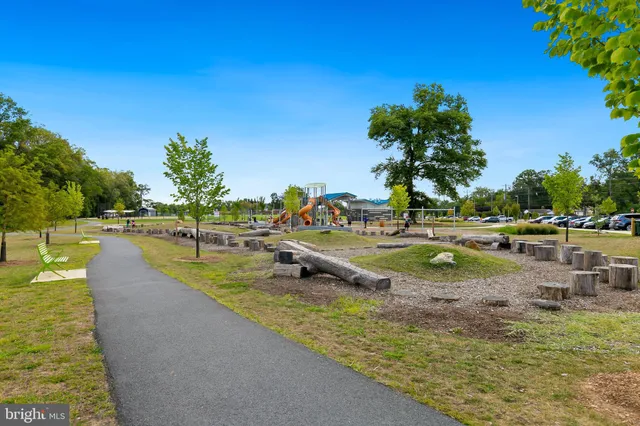 a view of a park with swings and slides