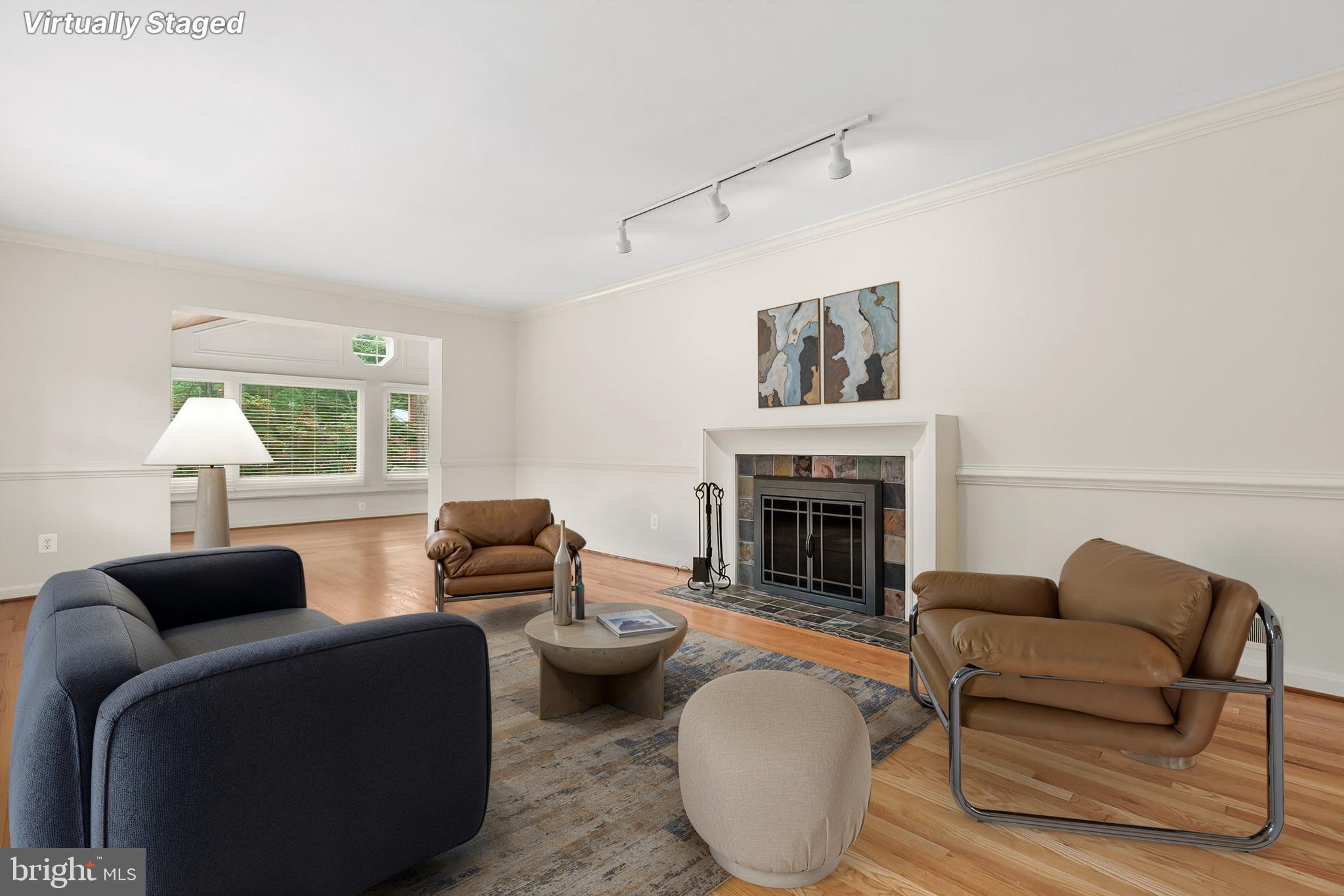 10601 Kinloch Road Silver Spring, MD 20903 - Photo 6 of 47 a living room with furniture and a fireplace