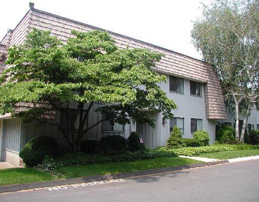 1183 Stratfield Road, Unit 202 Fairfield, CT 06825 - Photo 1 of 1 a front view of a house with garden