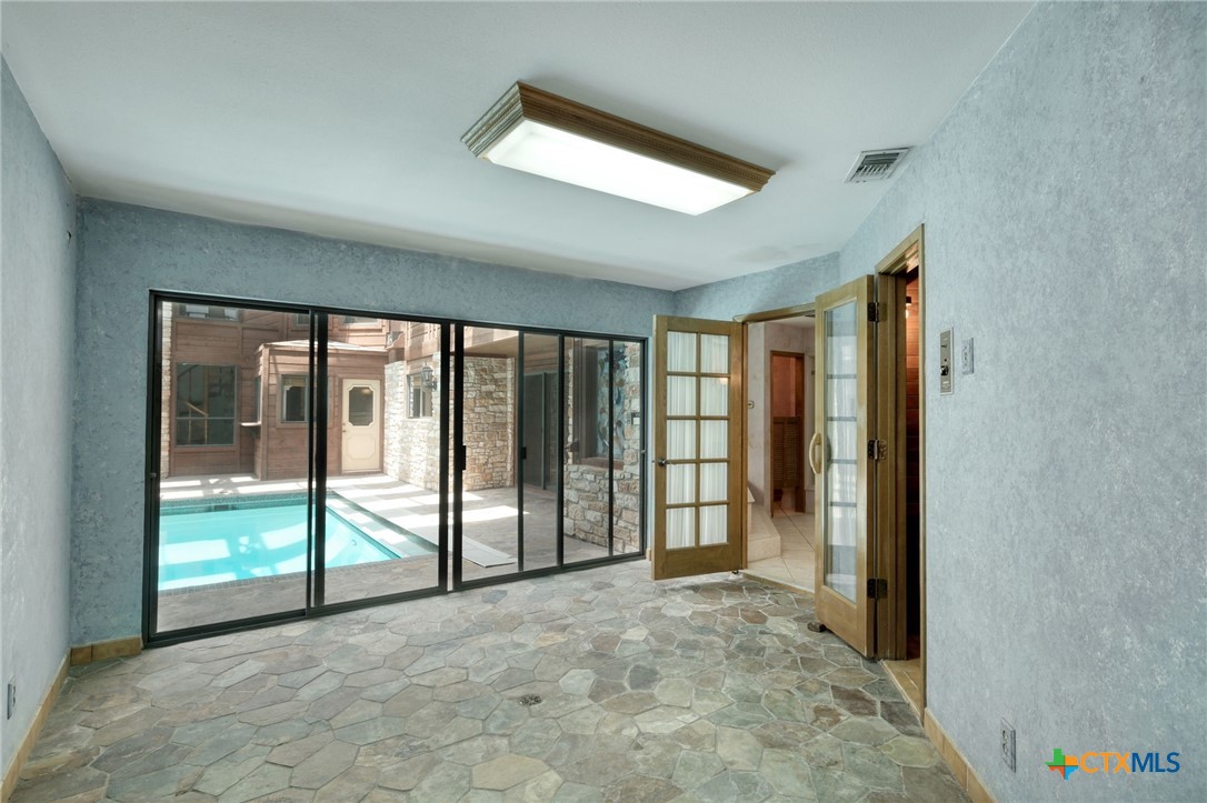 700 Breakaway Road Cedar Park, TX 78613 - Photo 13 of 38 Flex Space/workout room/yoga studio space off of Primary bathroom area.